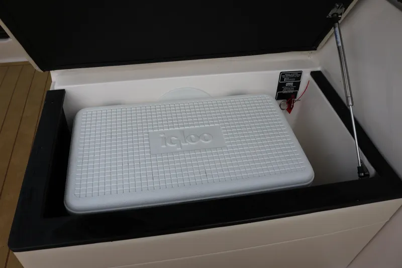  Yacht Photos Pics 2023 Regal 26 XO boat storage compartment with Igloo cooler inside.