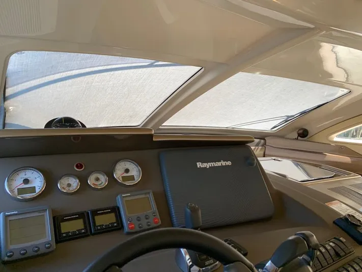 Family Affair Yacht Photos Pics Control panel of 2011 Cranchi 43 Atlantique yacht with Raymarine navigation system.