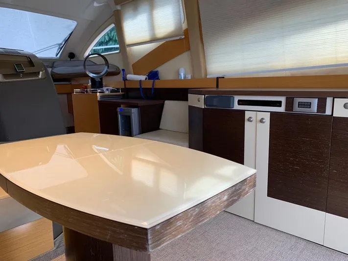 Family Affair Yacht Photos Pics Interior of 2011 Cranchi 43 Atlantique yacht with modern kitchen and dining area.
