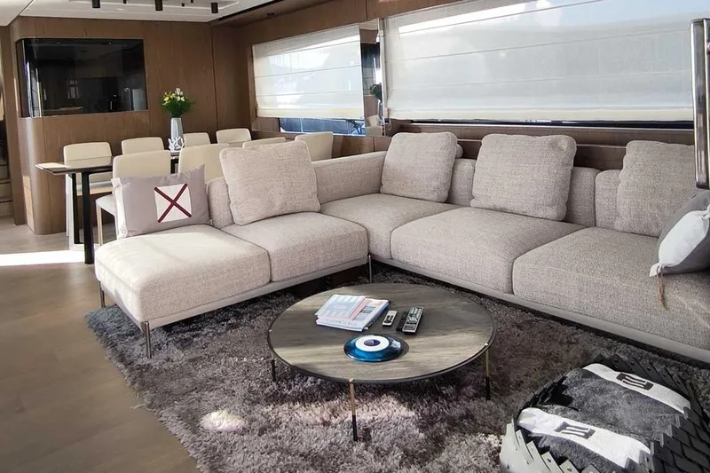 Karya Yacht Photos Pics Luxurious interior of 2023 Ferretti Yachts 780 with modern sofa and dining area.