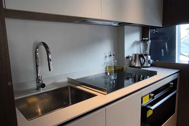 Karya Yacht Photos Pics Modern kitchen in 2023 Ferretti Yachts 780, featuring sleek appliances and minimalist design.