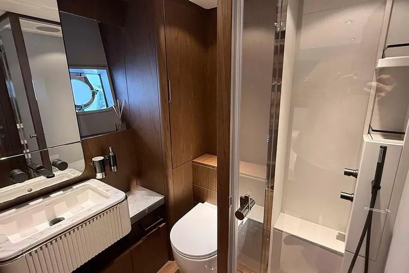 Karya Yacht Photos Pics Luxurious bathroom in 2023 Ferretti Yachts 780, featuring modern fixtures and elegant wood finishes.