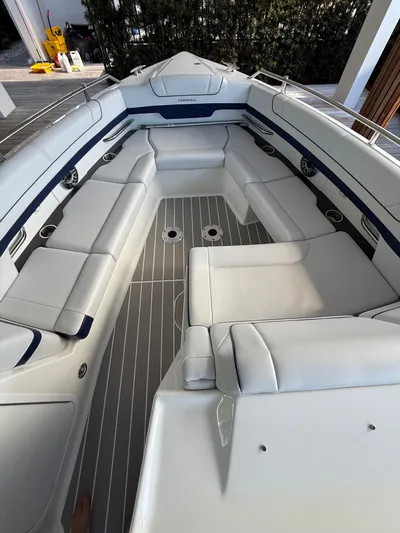 Sea Smoke Yacht Photos Pics Interior of a 2023 Formula 330 CBR boat with white seating.