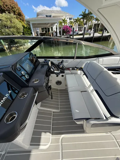 Sea Smoke Yacht Photos Pics Interior of 2023 Formula 330 CBR boat by the water.