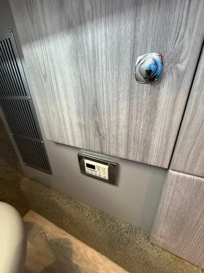 Sea Smoke Yacht Photos Pics Interior of 2023 Formula 330 CBR with wood paneling and control panel.