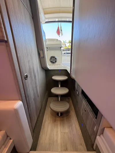 Sea Smoke Yacht Photos Pics Interior of 2023 Formula 330 CBR yacht with stairs and wood flooring.