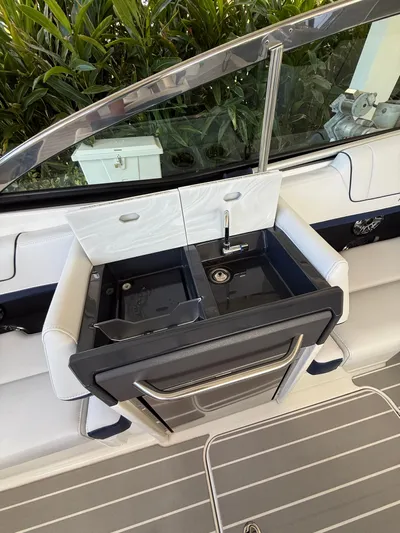 Sea Smoke Yacht Photos Pics 2023 Formula 330 CBR boat kitchenette with sink and storage.