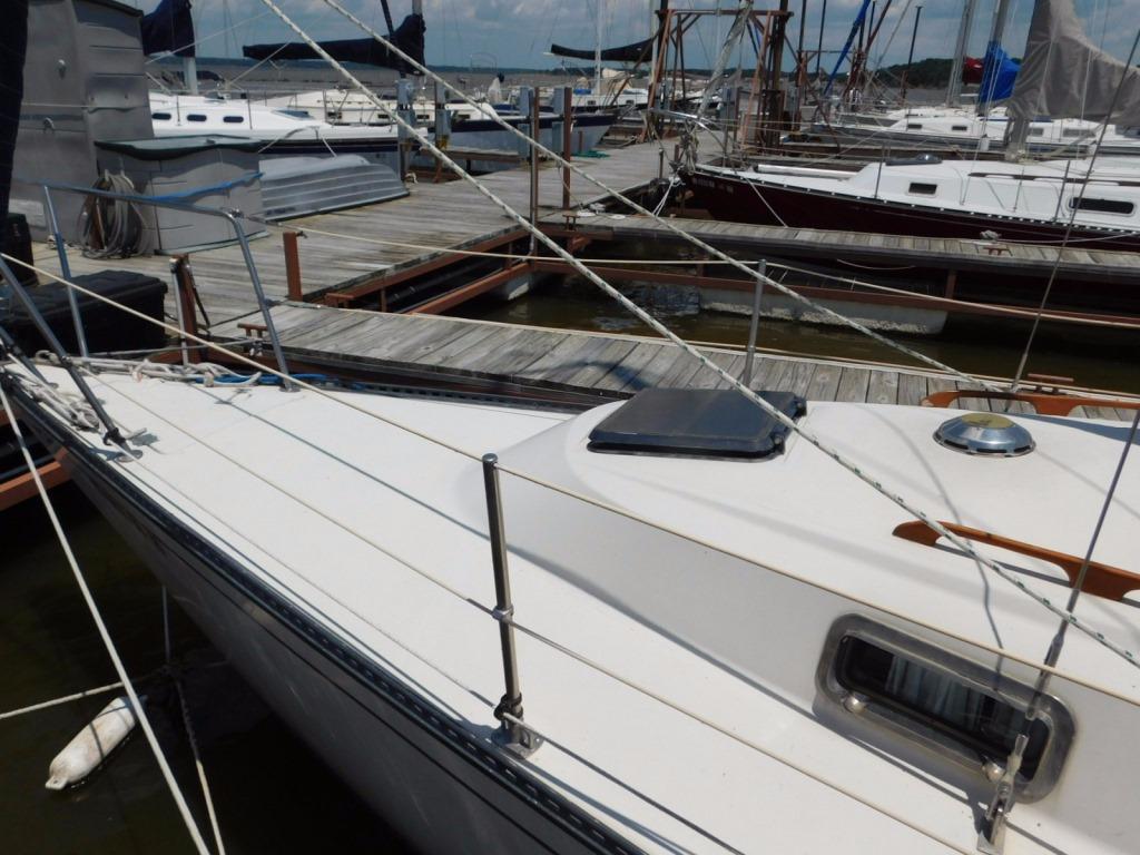 1981 Pearson 32 sailboat docked at marina, showcasing deck and rigging.