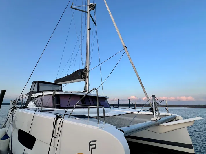 Amihan Yacht Photos Pics 2023 Fountaine Pajot Isla 40 catamaran docked at sunset.