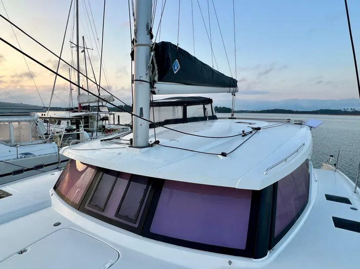 Amihan Yacht Photos Pics 2023 Fountaine Pajot Isla 40 catamaran docked at sunset, showcasing sleek design and modern features.