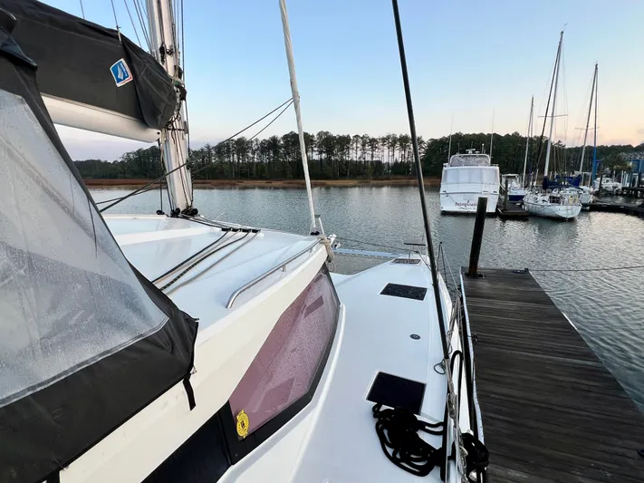 Amihan Yacht Photos Pics 2023 Fountaine Pajot Isla 40 catamaran docked at a serene marina.