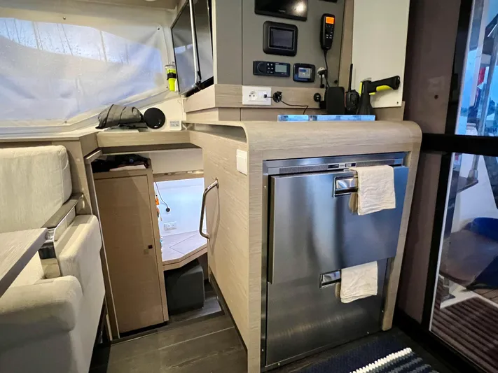 Amihan Yacht Photos Pics Interior of 2023 Fountaine Pajot Isla 40 catamaran with modern kitchen and navigation equipment.