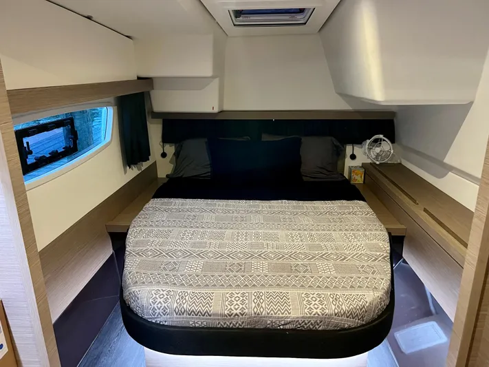 Amihan Yacht Photos Pics 2023 Fountaine Pajot Isla 40 cabin interior with bed, window, and modern design.