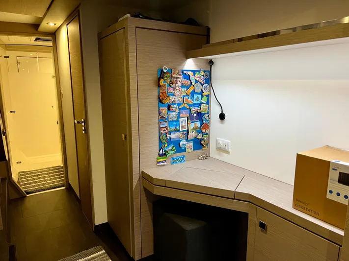Amihan Yacht Photos Pics Interior of 2023 Fountaine Pajot Isla 40 yacht with modern desk and hallway view.