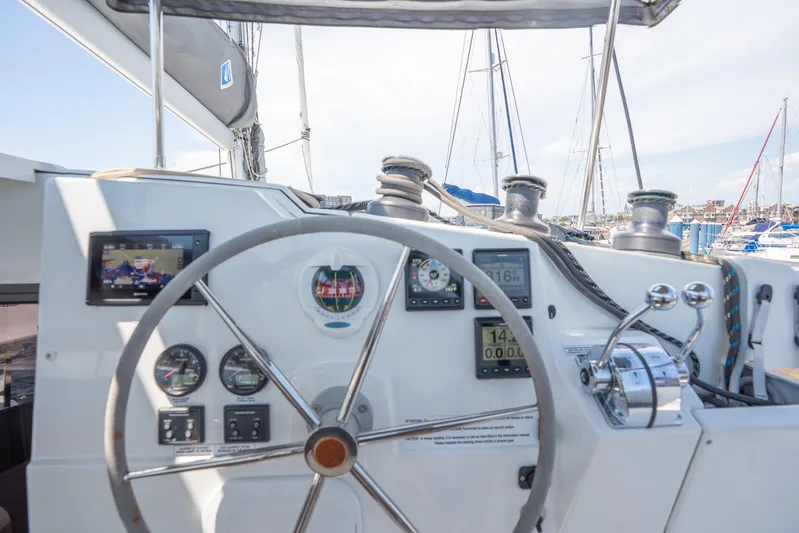 Amihan Yacht Photos Pics 2023 Fountaine Pajot Isla 40 yacht helm with navigation instruments and steering wheel.