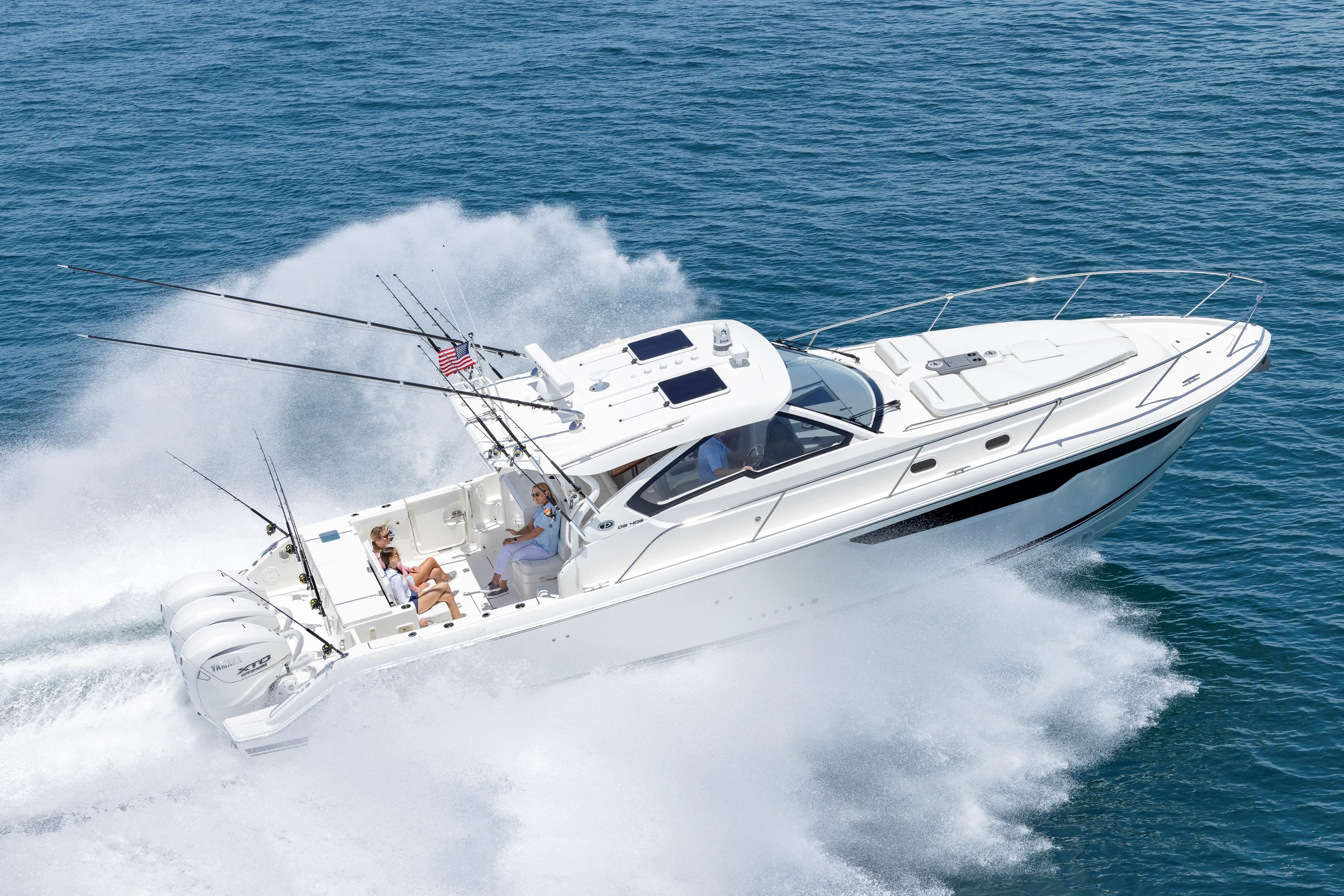2026 Pursuit OS 405 Offshore boat cruising on open water, showcasing sleek design and powerful engines.