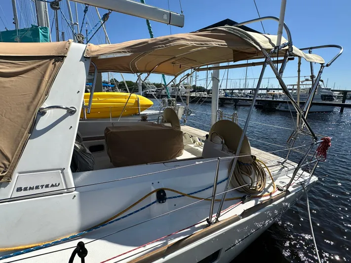 Yes My Dear Yacht Photos Pics Beneteau Oceanis 41 sailboat, 2012 model, docked at marina with beige canopy.
