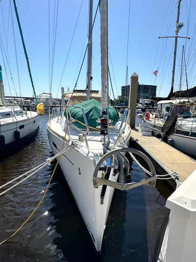 Yes My Dear Yacht Photos Pics 2012 Beneteau Oceanis 41 sailboat docked at marina under clear blue sky.