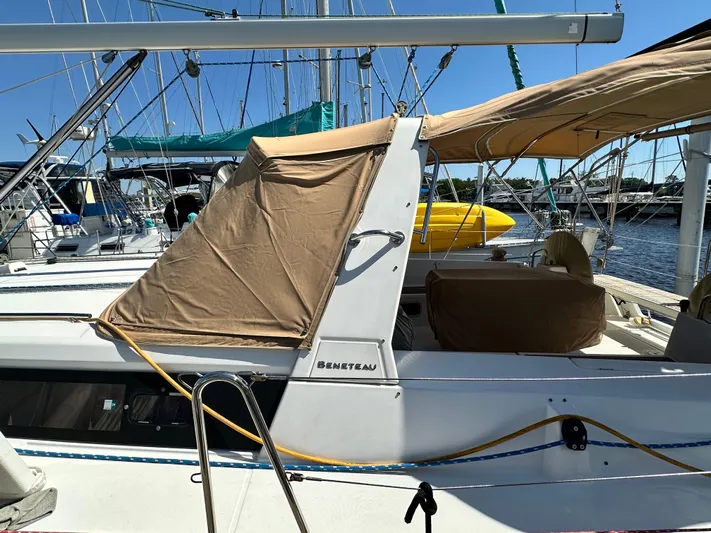 Yes My Dear Yacht Photos Pics Beneteau Oceanis 41 sailboat, 2012 model, docked with tan canvas cover.