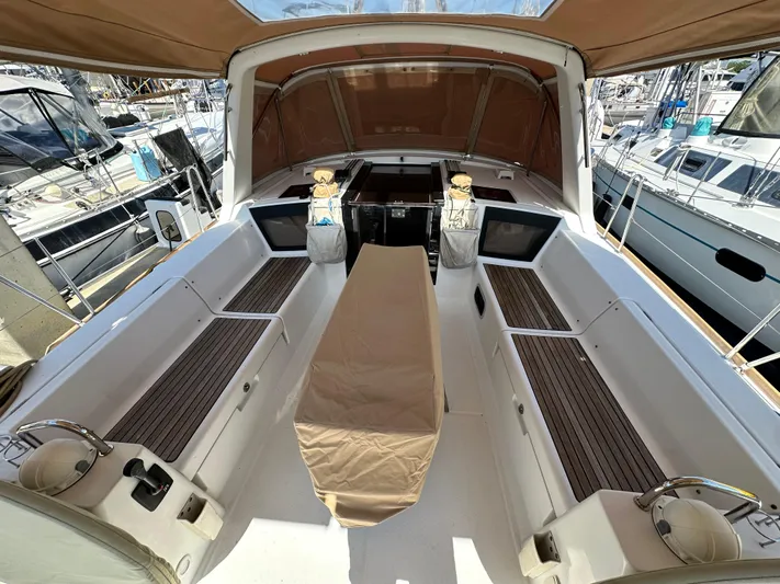 Yes My Dear Yacht Photos Pics Beneteau Oceanis 41 cockpit, 2012 model, featuring spacious seating and covered table.