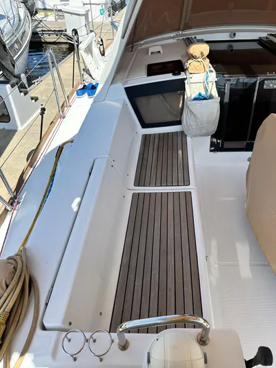 Yes My Dear Yacht Photos Pics Beneteau Oceanis 41 sailboat deck, 2012 model, featuring teak flooring and docked at a marina.