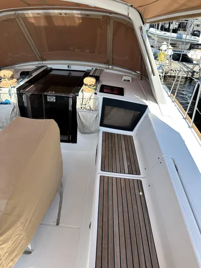 Yes My Dear Yacht Photos Pics Beneteau Oceanis 41 cockpit, 2012 model, featuring teak flooring and covered seating.