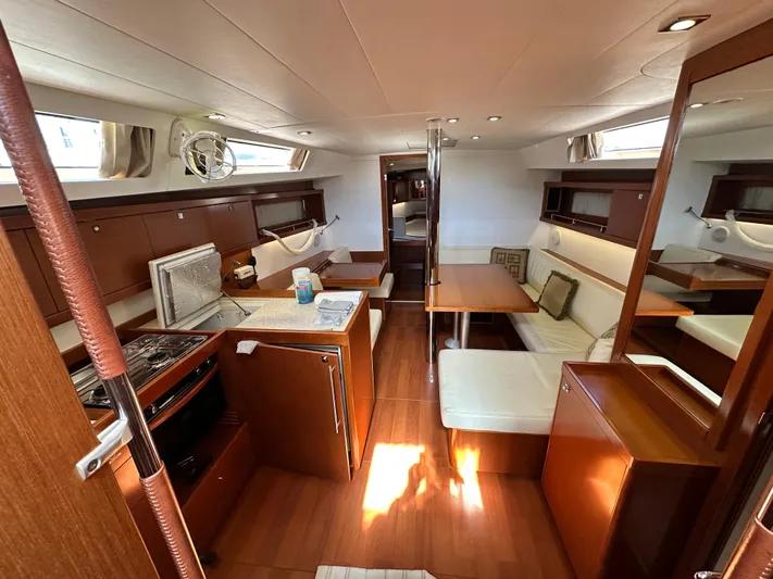 Yes My Dear Yacht Photos Pics Interior of 2012 Beneteau Oceanis 41 yacht with kitchen and seating area.