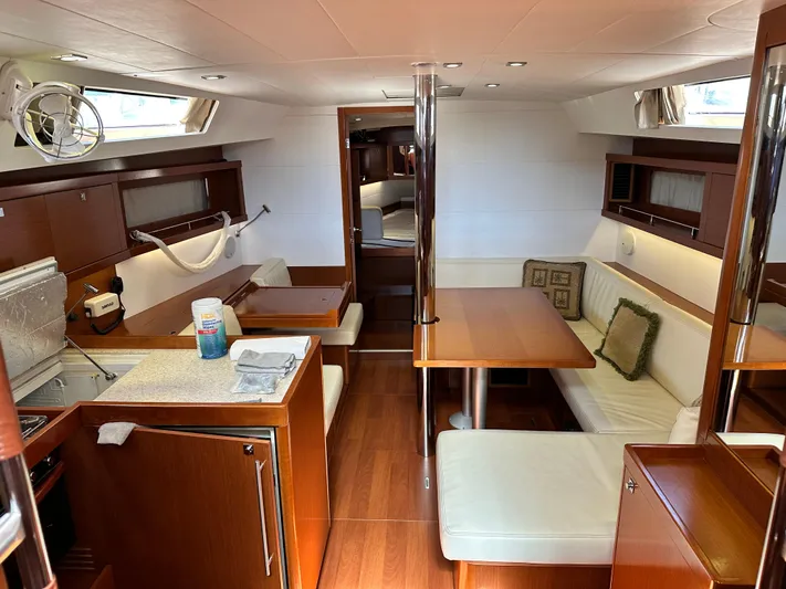 Yes My Dear Yacht Photos Pics Interior of 2012 Beneteau Oceanis 41 sailboat with modern wood and white furnishings.