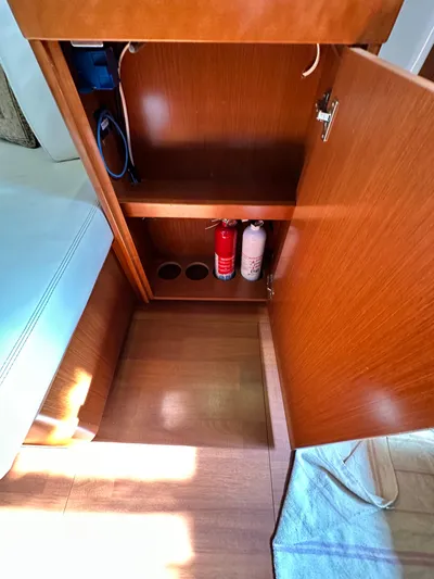 Yes My Dear Yacht Photos Pics Interior cabinet of 2012 Beneteau Oceanis 41 yacht with fire extinguishers.