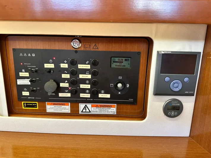 Yes My Dear Yacht Photos Pics Control panel of 2012 Beneteau Oceanis 41 sailboat with various switches and displays.