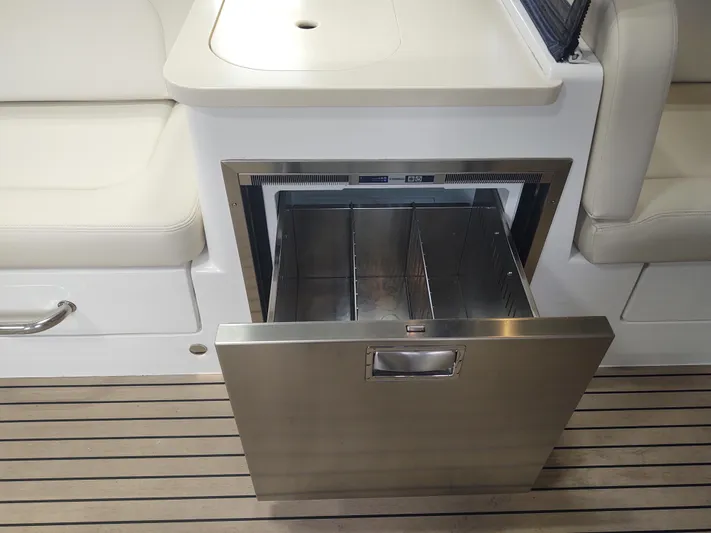 Coco Yacht Photos Pics Stainless steel drawer on 2022 MJM 3z boat, open on teak deck.