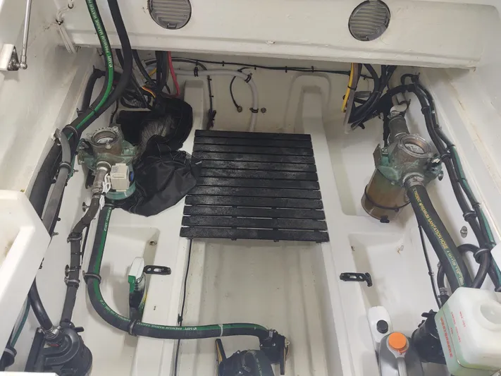 Coco Yacht Photos Pics Engine compartment of 2022 MJM 3z boat with visible hoses and components.