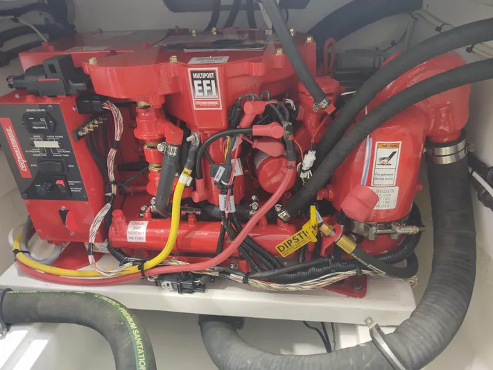 Coco Yacht Photos Pics MJM 3z 2022 engine compartment with red EFI system and various hoses.