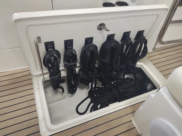 Coco Yacht Photos Pics MJM 3z 2022 boat storage compartment with neatly organized black ropes.