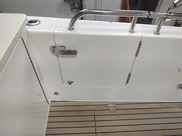 Coco Yacht Photos Pics MJM 3z 2022 boat deck with white hatch and stainless steel railing.