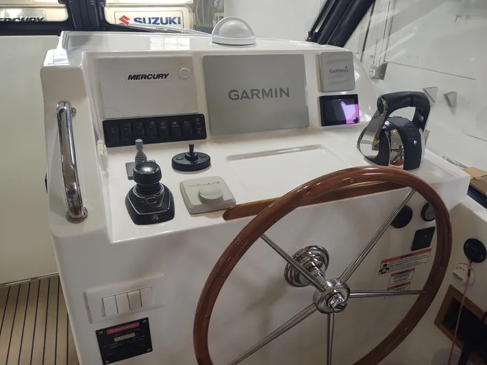 Coco Yacht Photos Pics MJM 3z 2022 boat helm with Garmin and Mercury controls.