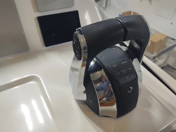 Coco Yacht Photos Pics Throttle control lever on 2022 MJM 3z boat dashboard.