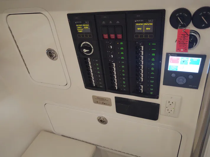 Coco Yacht Photos Pics Control panel of 2022 MJM 3z boat with switches and digital display.