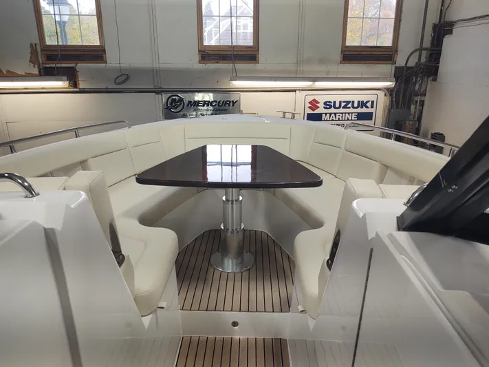 Coco Yacht Photos Pics Luxurious seating area on 2022 MJM 3z boat with wooden flooring.
