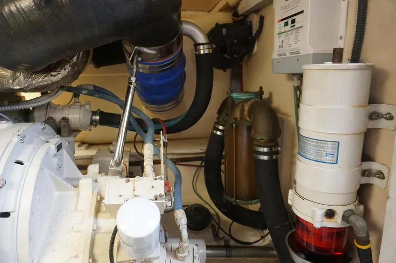 Sea Striker Yacht Photos Pics Engine room of 2005 Mirage Yachts 40 Convertible, showcasing mechanical components and systems.