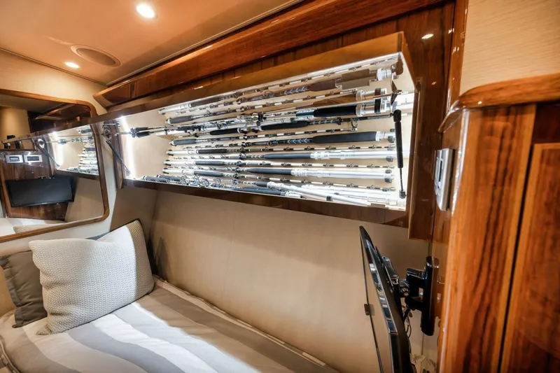 Triple Trouble Yacht Photos Pics Luxurious 2014 Viking 62 Convertible yacht interior with fishing rod storage.