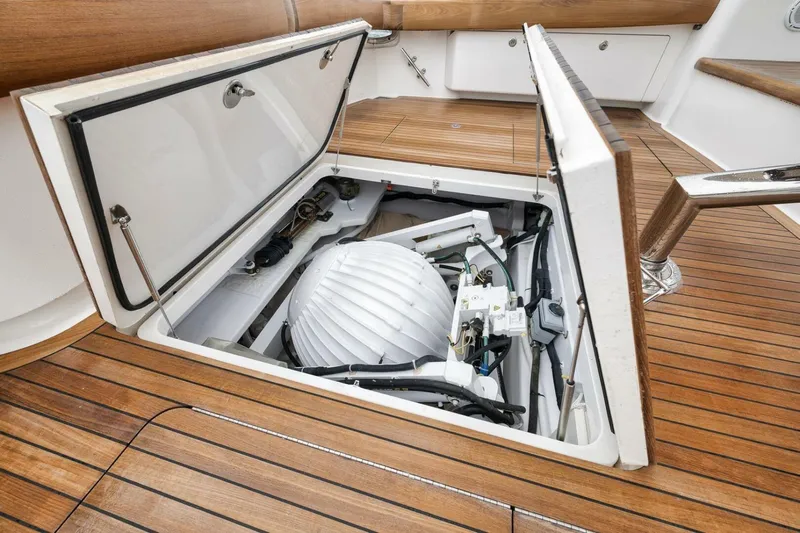 Triple Trouble Yacht Photos Pics 2014 Viking 62 Convertible yacht engine compartment with open hatch, showcasing mechanical components.