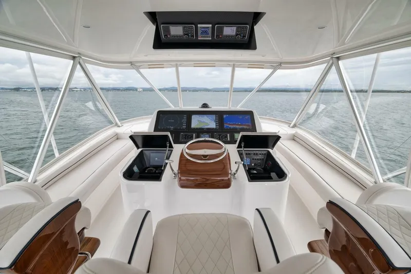 Triple Trouble Yacht Photos Pics Luxurious helm of 2014 Viking 62 Convertible yacht with advanced navigation systems.