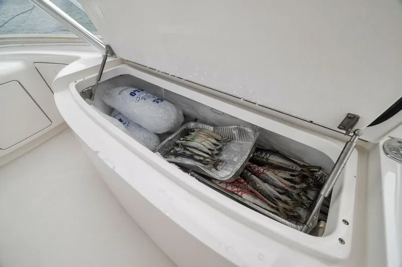 Triple Trouble Yacht Photos Pics Ice-filled cooler with fish on a 2014 Viking 62 Convertible yacht.