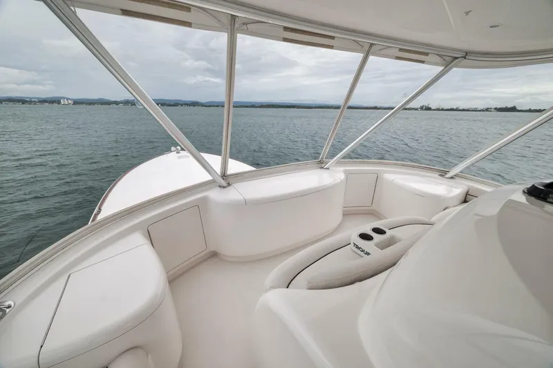 Triple Trouble Yacht Photos Pics Luxurious interior of 2014 Viking 62 Convertible yacht with ocean view.