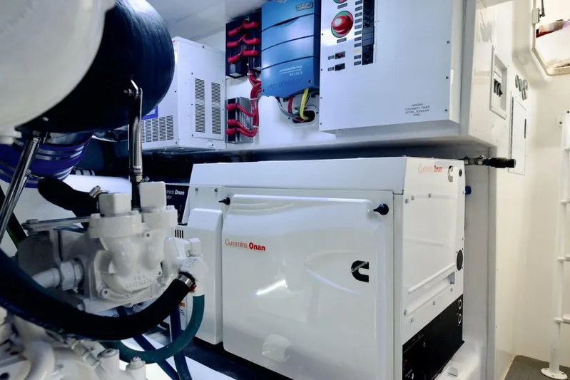 Triple Trouble Yacht Photos Pics Engine room of 2014 Viking 62 Convertible yacht with Cummins Onan generator.