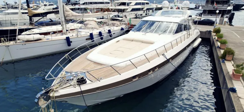  Yacht Photos Pics Luxury 2006 Mangusta 80 yacht docked in marina, surrounded by other boats.