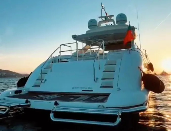  Yacht Photos Pics Luxury 2006 Mangusta 80 yacht at sunset on the water.