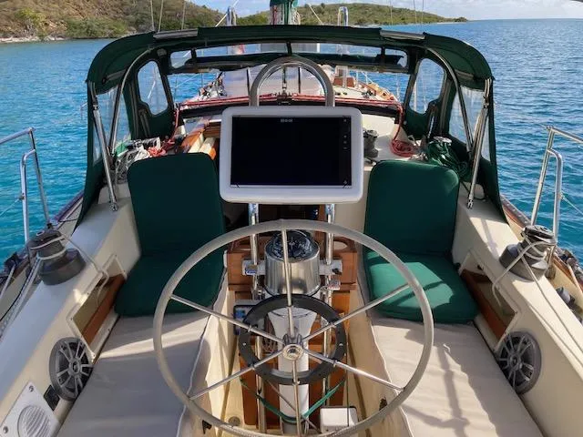 Hero Yacht Photos Pics Cockpit of 1992 Pacific Seacraft 37 Cutter with steering wheel and navigation equipment.