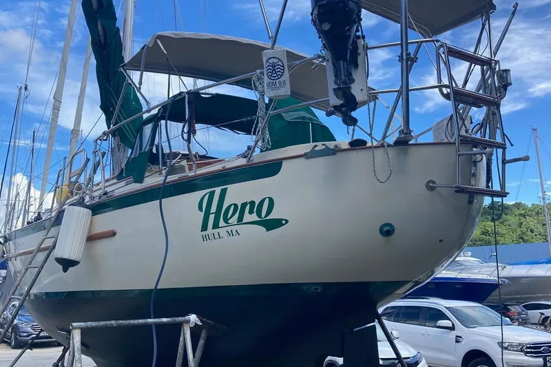 Hero Yacht Photos Pics 1992 Pacific Seacraft 37 Cutter sailboat named "Hero" in a marina setting.